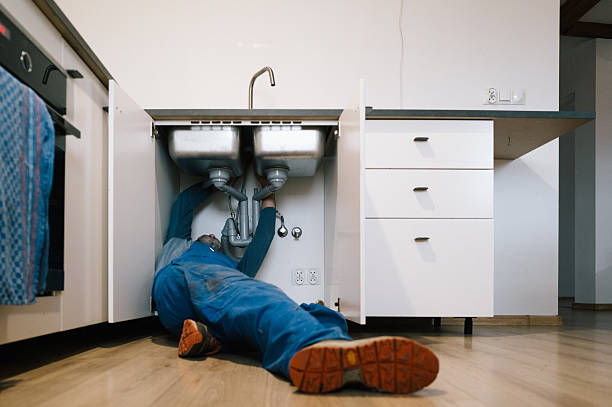 Professional Plumbing technician working in Runnells, IA